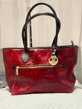 Valentina, Italian floral embossed leather tote. EUC outside, ink marks inside